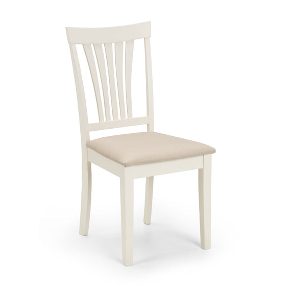 White chair with beige cushion on a white background
