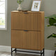Wooden cabinet with two doors against a gray wall with a plant and framed picture on top.