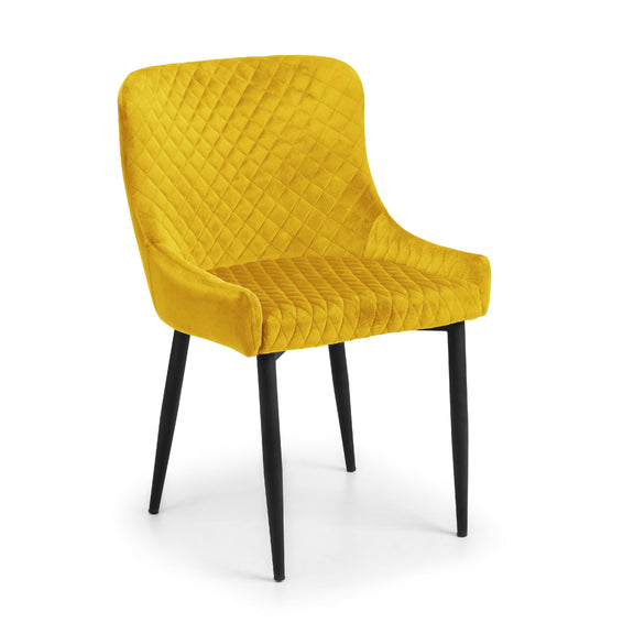 Yellow upholstered chair with black legs on a white background