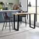 Modern kitchen with a wooden dining table and bar stools.