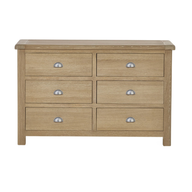 Wooden dresser with six drawers on a white background