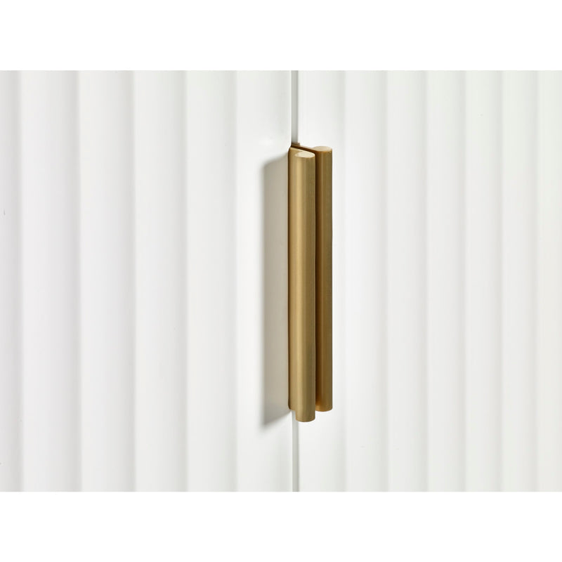 Gold cabinet handle on a white cabinet door
