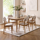 Dining room with wooden table and chairs on a white rug