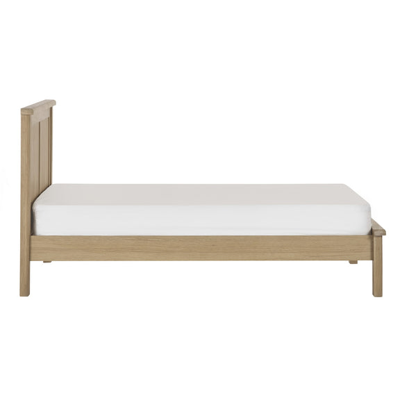 Wooden bed frame with a white mattress on a white background