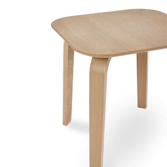 Wooden table with a light finish on a white background
