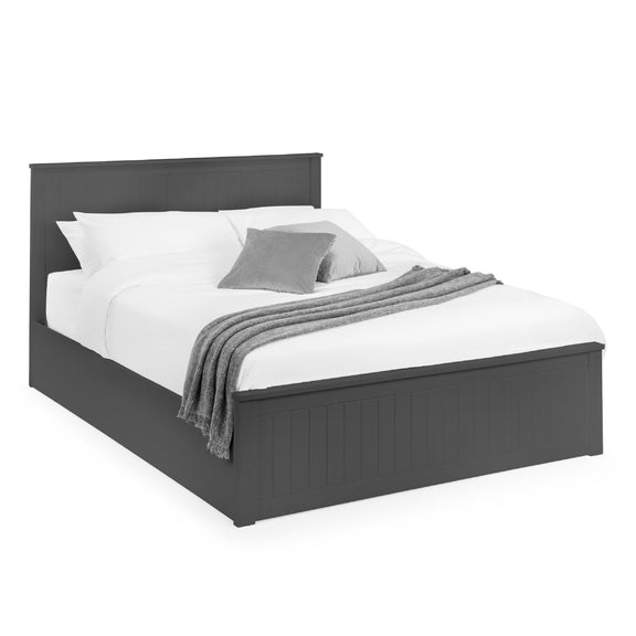 Gray bed frame with white bedding and gray blanket on a white background