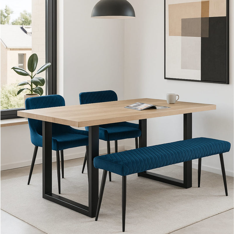 Dining room with a wooden table, blue chairs, and a bench.