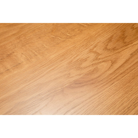 Close-up of a wooden surface with a light brown color and visible grain pattern.