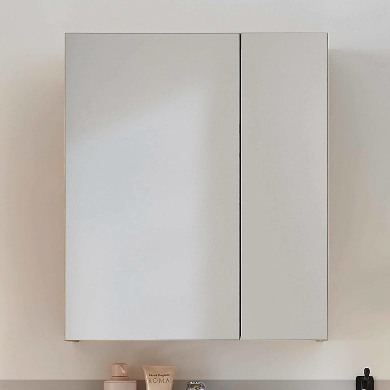Two-toned wall cabinet with a neutral color scheme on a light background