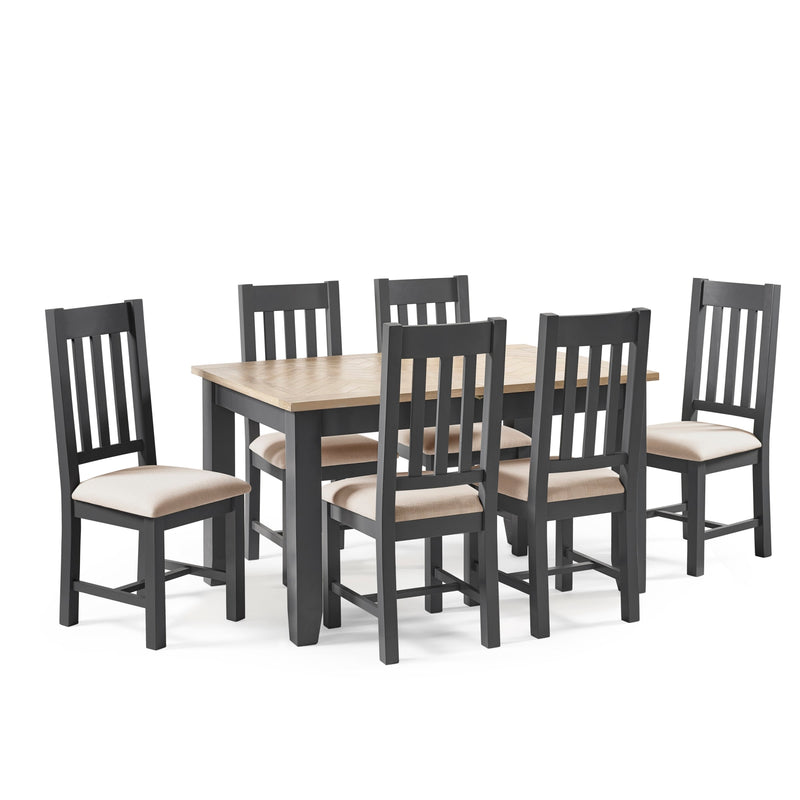 Dining table set with six chairs on a white background