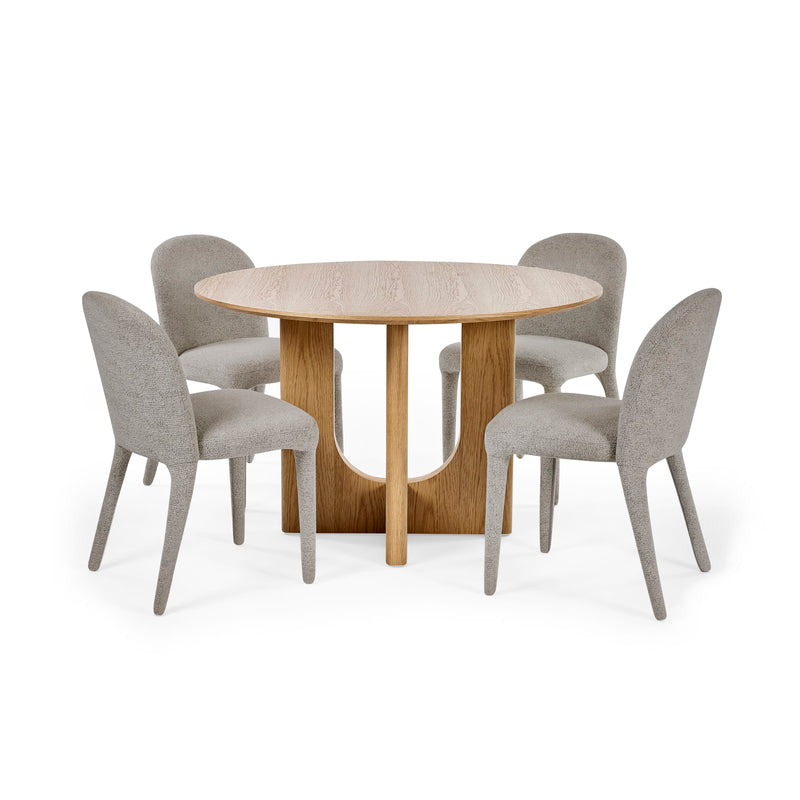 Round dining table with four gray chairs on a white background