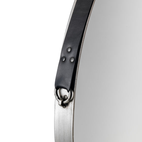 Close-up of a watch with a black band and silver case on a white background