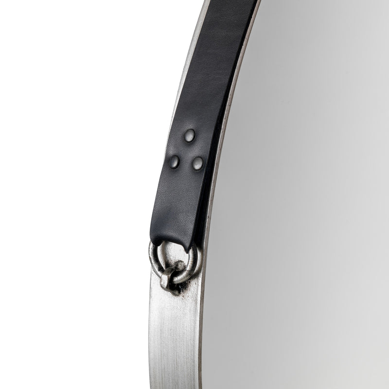 Close-up of a watch with a black band and silver case on a white background