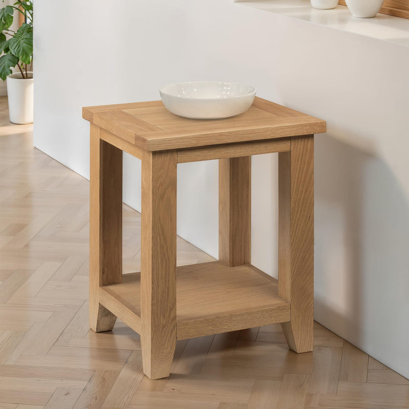 Wooden side table with a bowl on top in a room setting