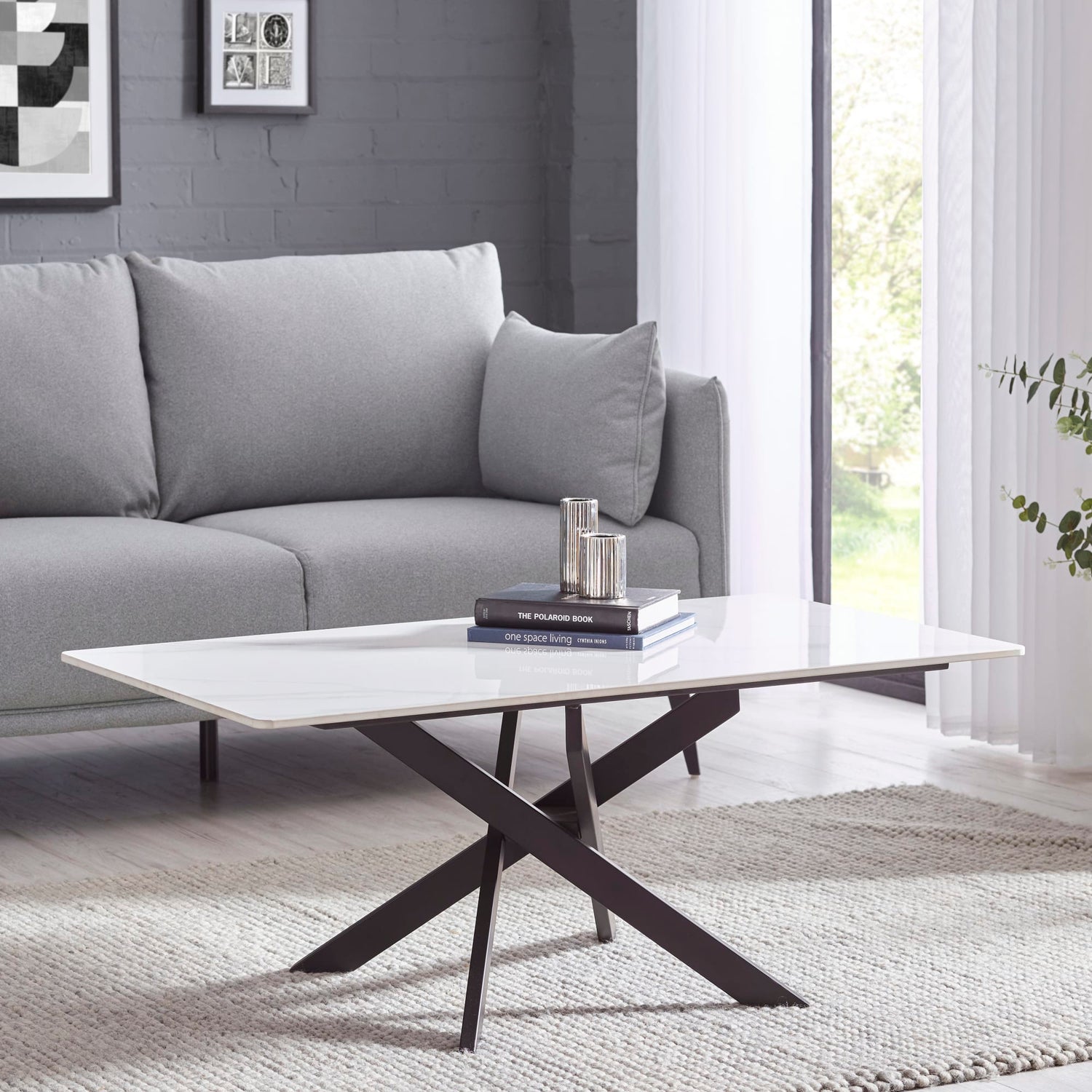 Modern living room with a gray sofa and a coffee table.