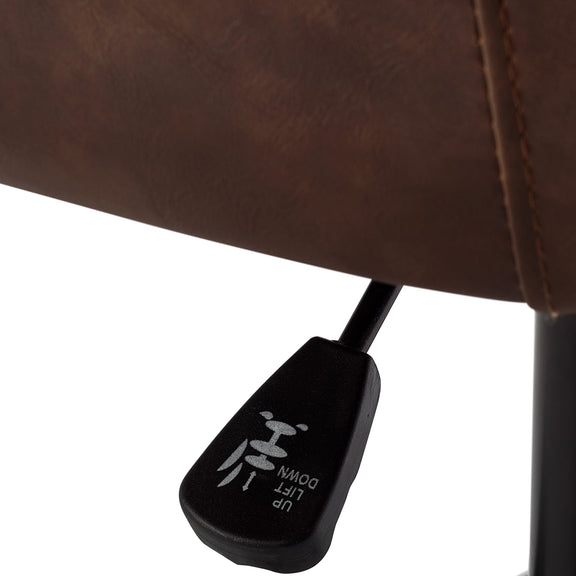 Black footrest with control buttons on a brown leather chair.