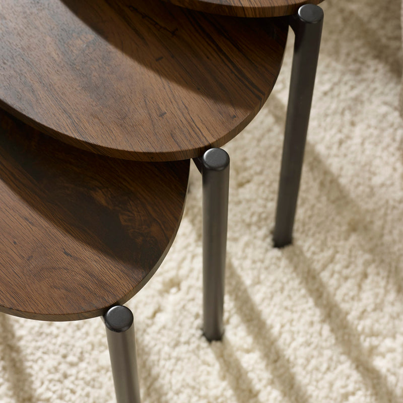 Wooden side table with metal legs on a textured surface