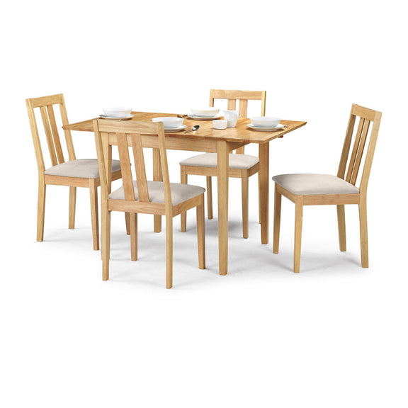 Wooden dining table set with four chairs on a white background