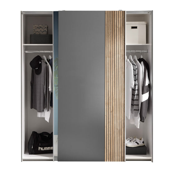 Modern wardrobe with open doors displaying clothes and shoes on a white background