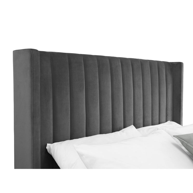 Gray upholstered headboard with white bedding on a white background