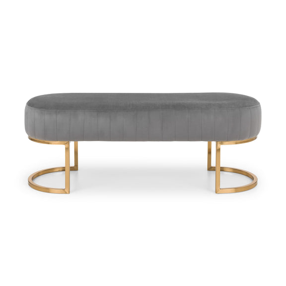 Gray upholstered bench with gold metal legs on a white background