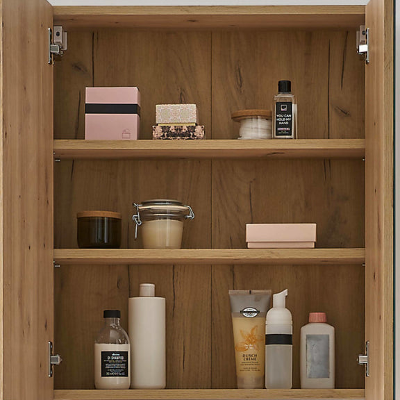Wooden cabinet with various skincare products on shelves