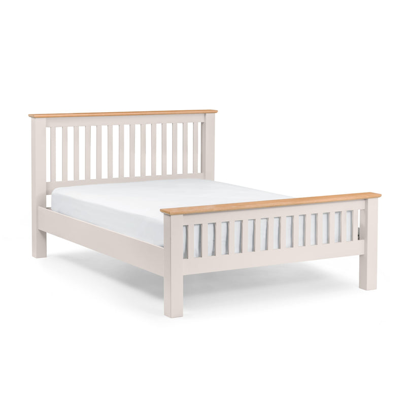 White bed frame with wooden top and footboard on a white background