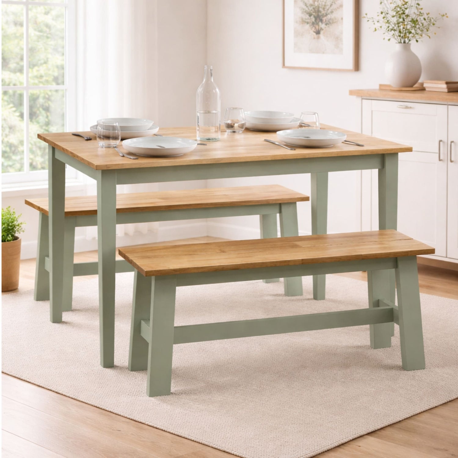 Dining table with benches in a bright room