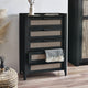 Black dresser with wicker drawers in a room setting