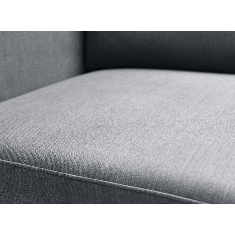 Close-up of a gray upholstered chair seat with a white background