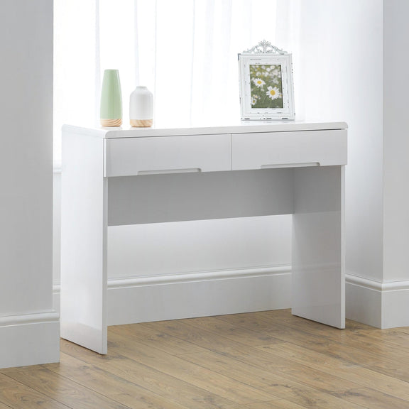White console table with two drawers and a small mirror on a wooden floor.