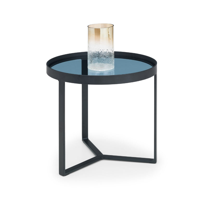 Small round table with a blue glass top and black metal frame on a white background