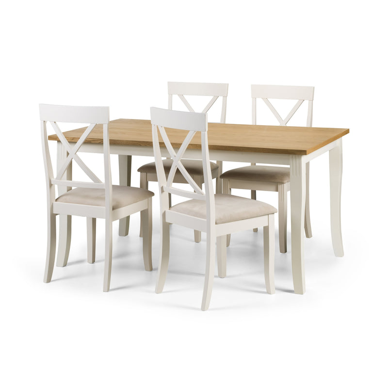 Dining table set with four chairs on a white background