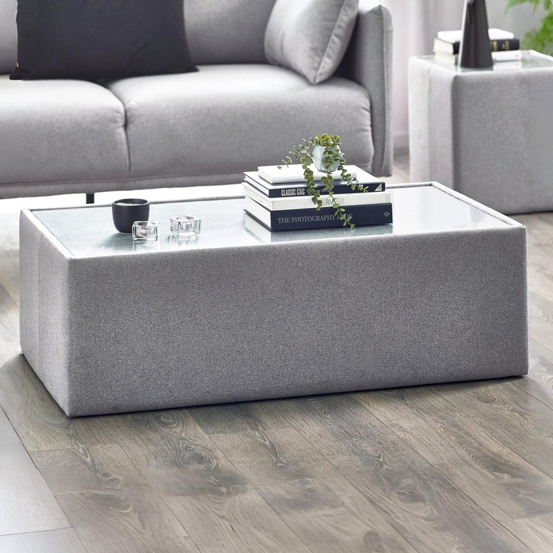Gray coffee table with decorative items in a living room setting