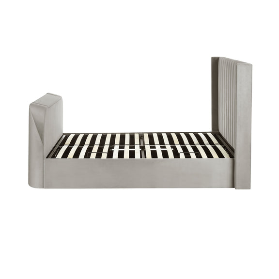 Modern bed with striped mattress on a white background