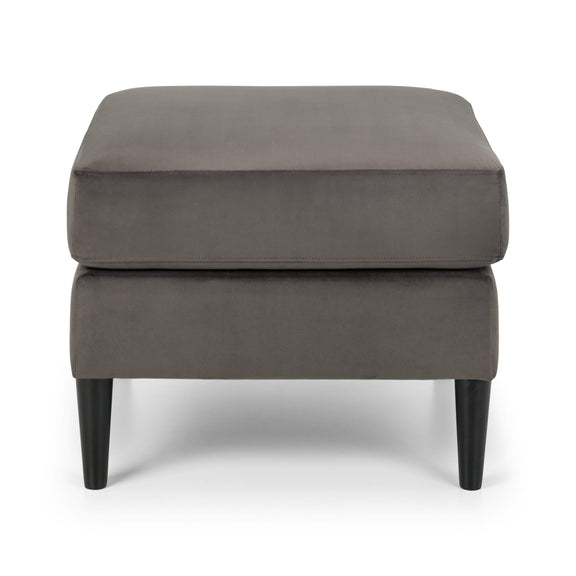 Gray upholstered ottoman with black legs on a white background