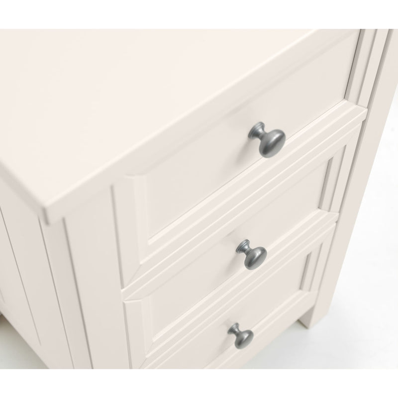 White cabinet with silver knobs on a white background