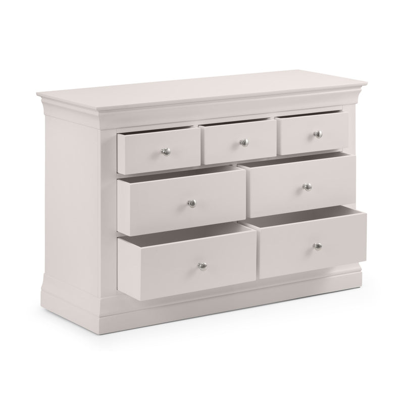 White dresser with multiple drawers on a white background