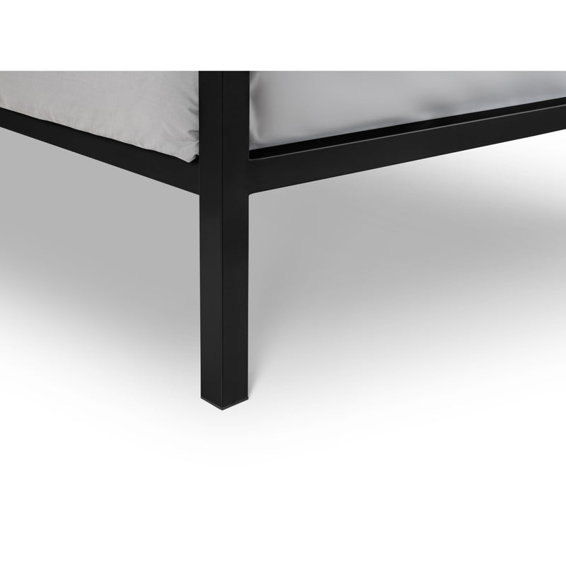 Black metal bed frame corner on a white background
