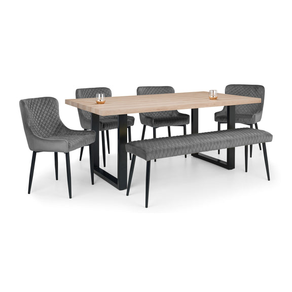 Dining table set with four chairs and a bench on a white background