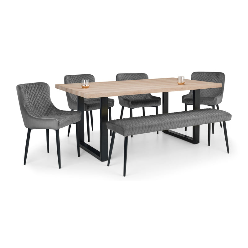 Dining table set with four chairs and a bench on a white background