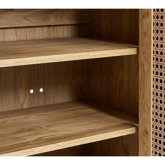 Wooden shelf with two shelves and a textured wall on the right.