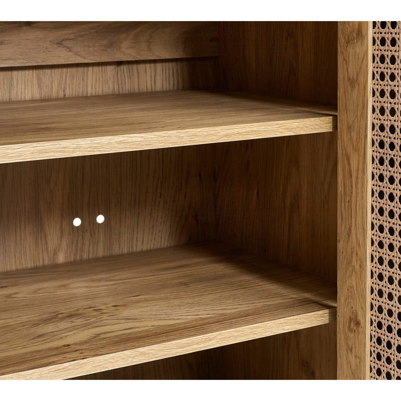 Wooden shelf with two shelves and a textured wall on the right.