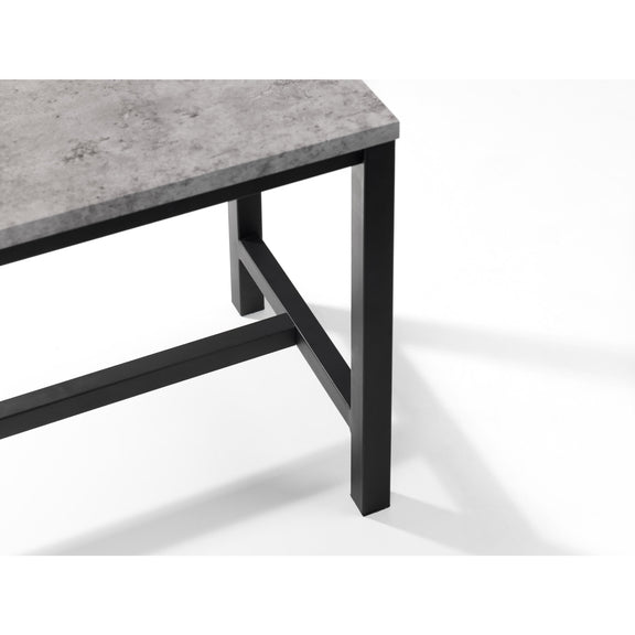 Table with concrete top and black metal legs on a white background