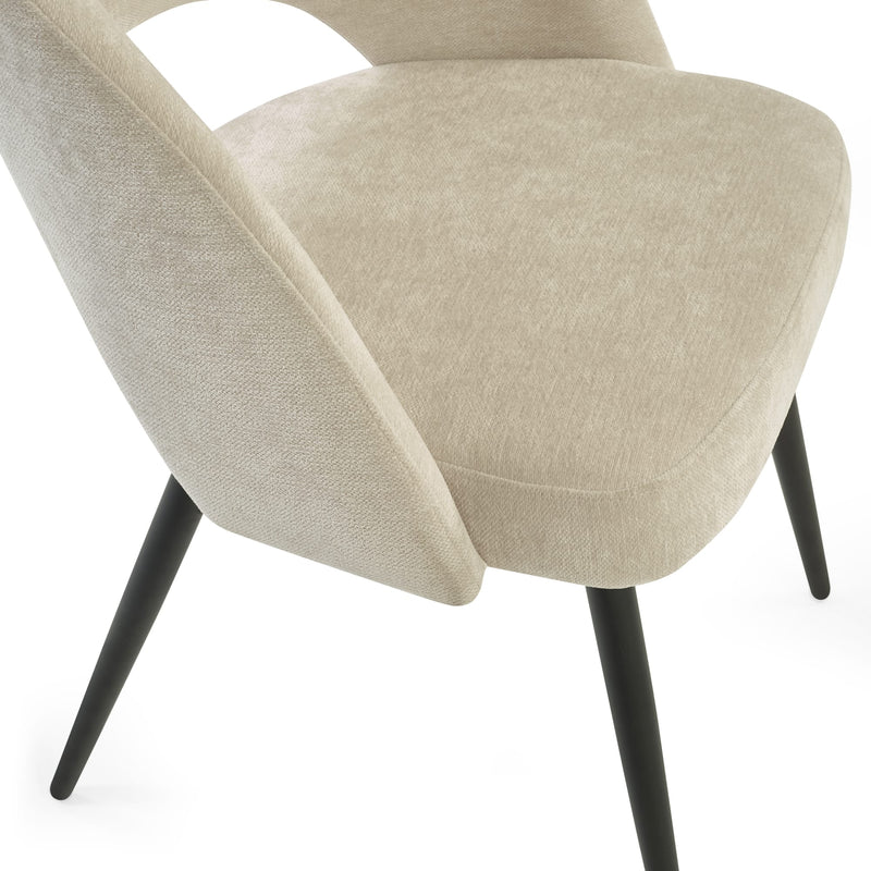 Beige armchair with black legs on a white background