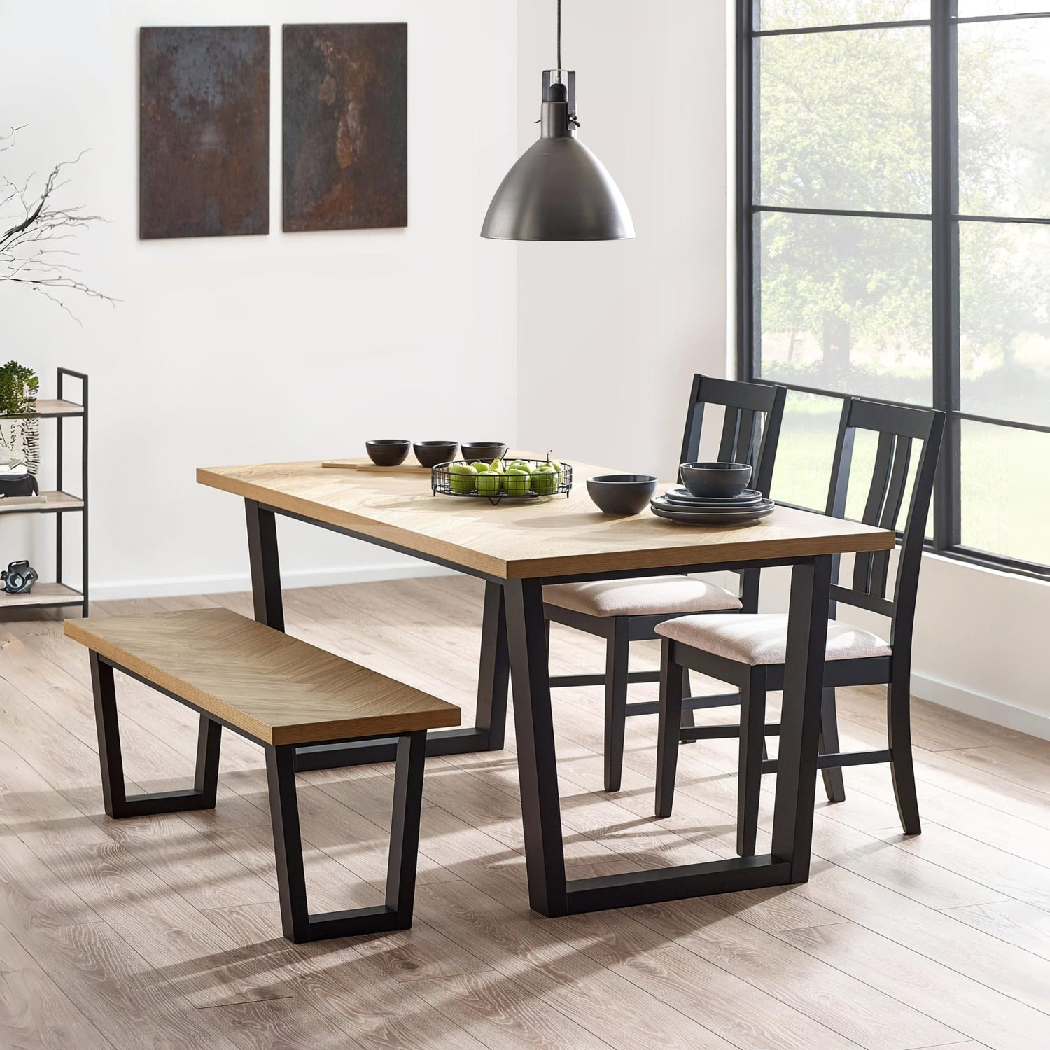 Dining room with wooden table, chairs, and bench in a modern interior setting.
