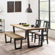Dining room with wooden table, chairs, and bench in a modern interior setting.