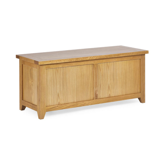 Wooden storage bench with a light finish on a white background
