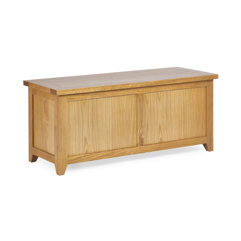 Wooden storage bench with a light finish on a white background