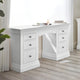 White desk with multiple drawers in a room with light wood flooring and white walls.